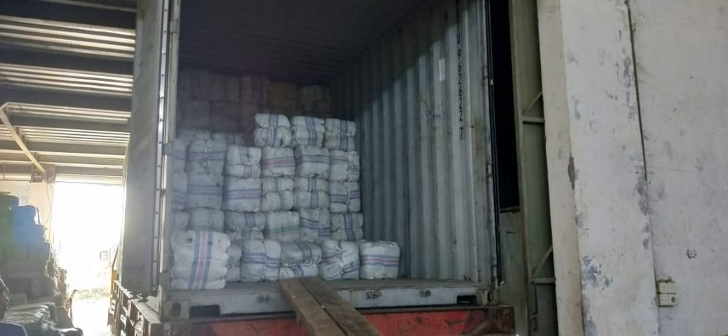 Bags of dried seaweed loaded into a shipping container