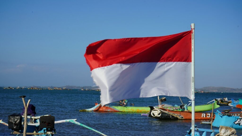 A boat with a flag on the water